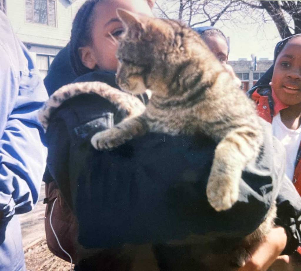 Afura as a child with cat