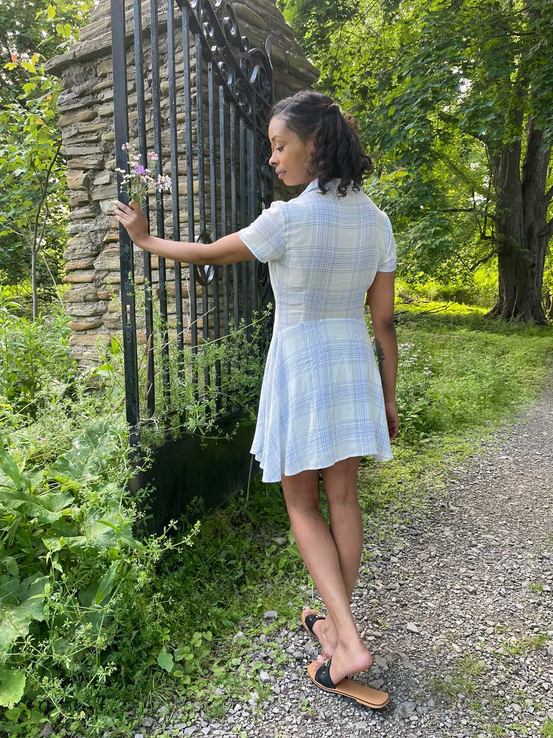 Afura at garden gate with wildflowers