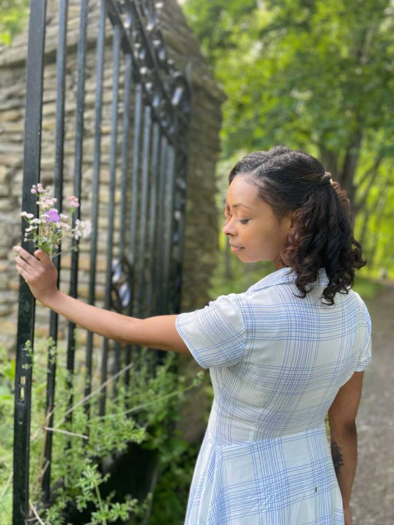 Afura-at-garden-gate-with-wild-flowers-8