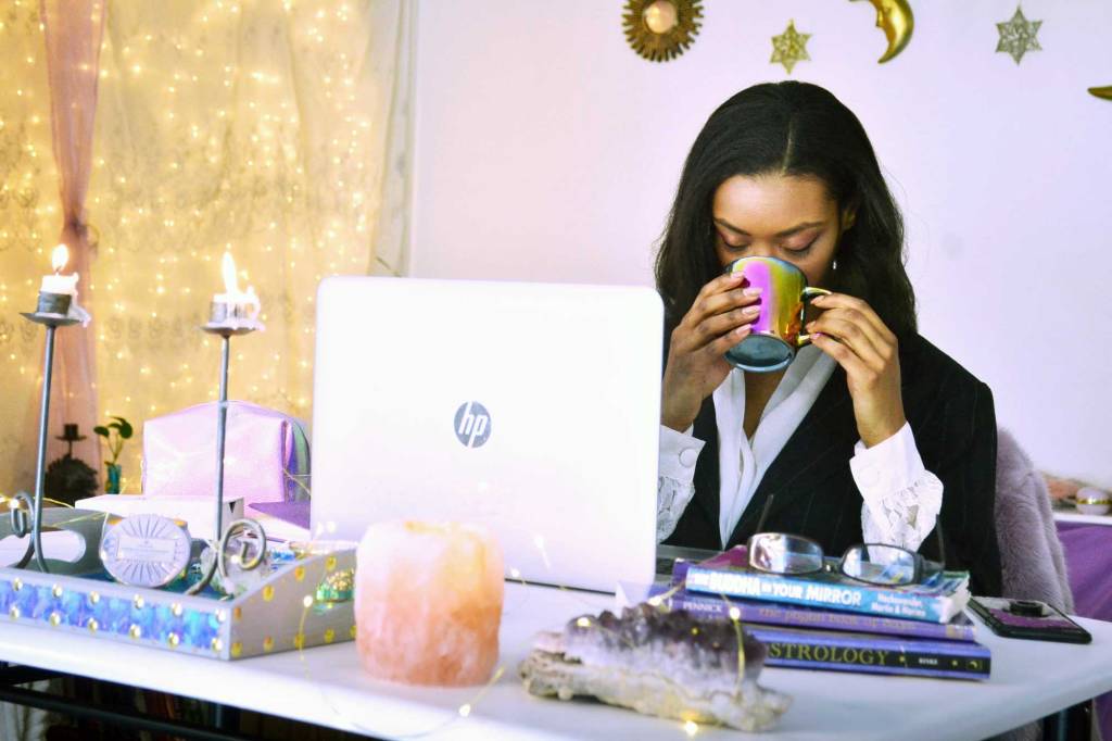 afura at witchy business desk with laptop