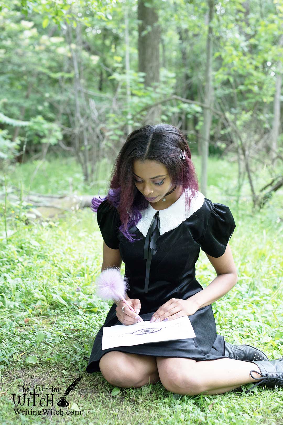 Afura writing and drawing outdoors